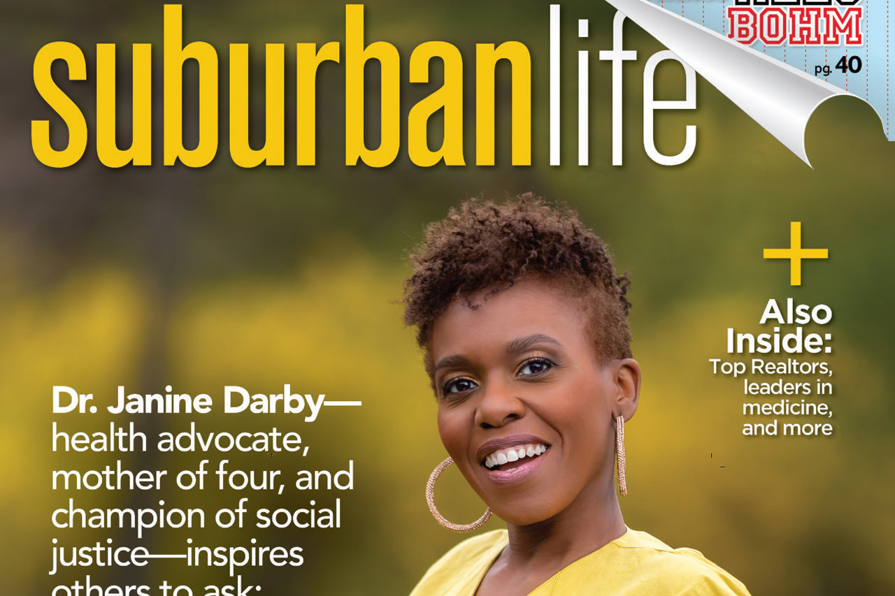 Dr Darby on the cover of suburban life magazine in a yellow dress