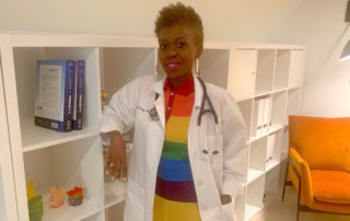 Dr Darby wearing a rainbow shirt in a savvy mainline magazine
