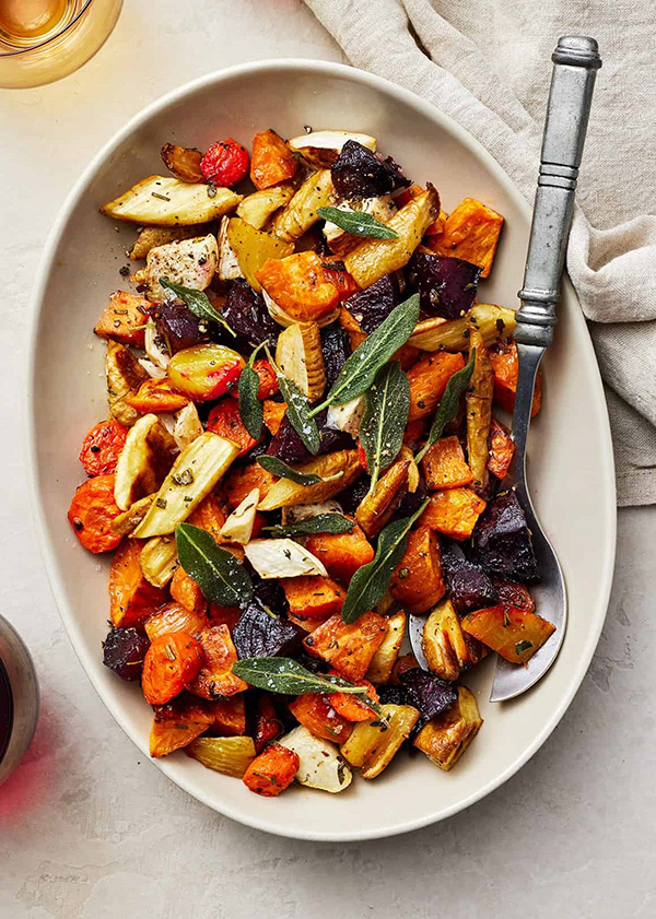 roasted root vegetables in a white bowl